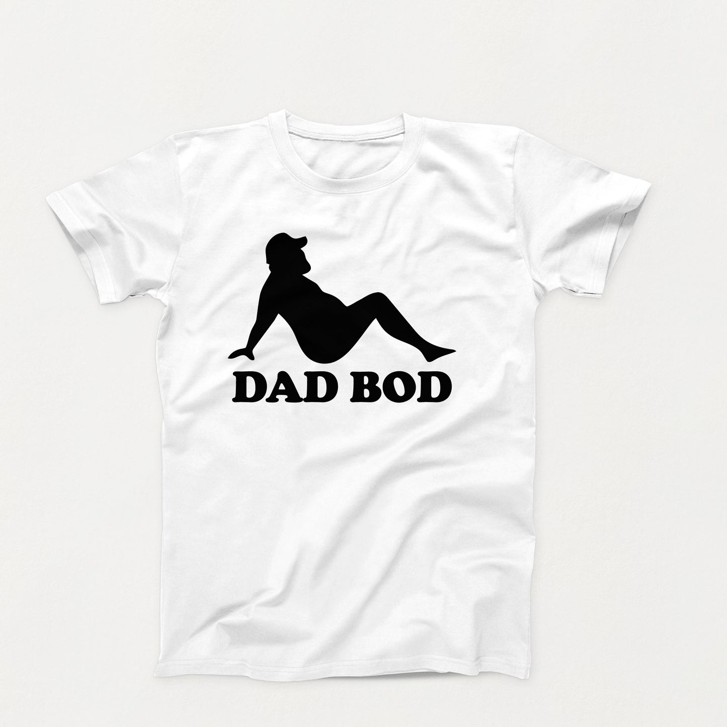 black silhouette of a relaxed bearded man in a cap with the words “Dad Bod” below on a white shirt design