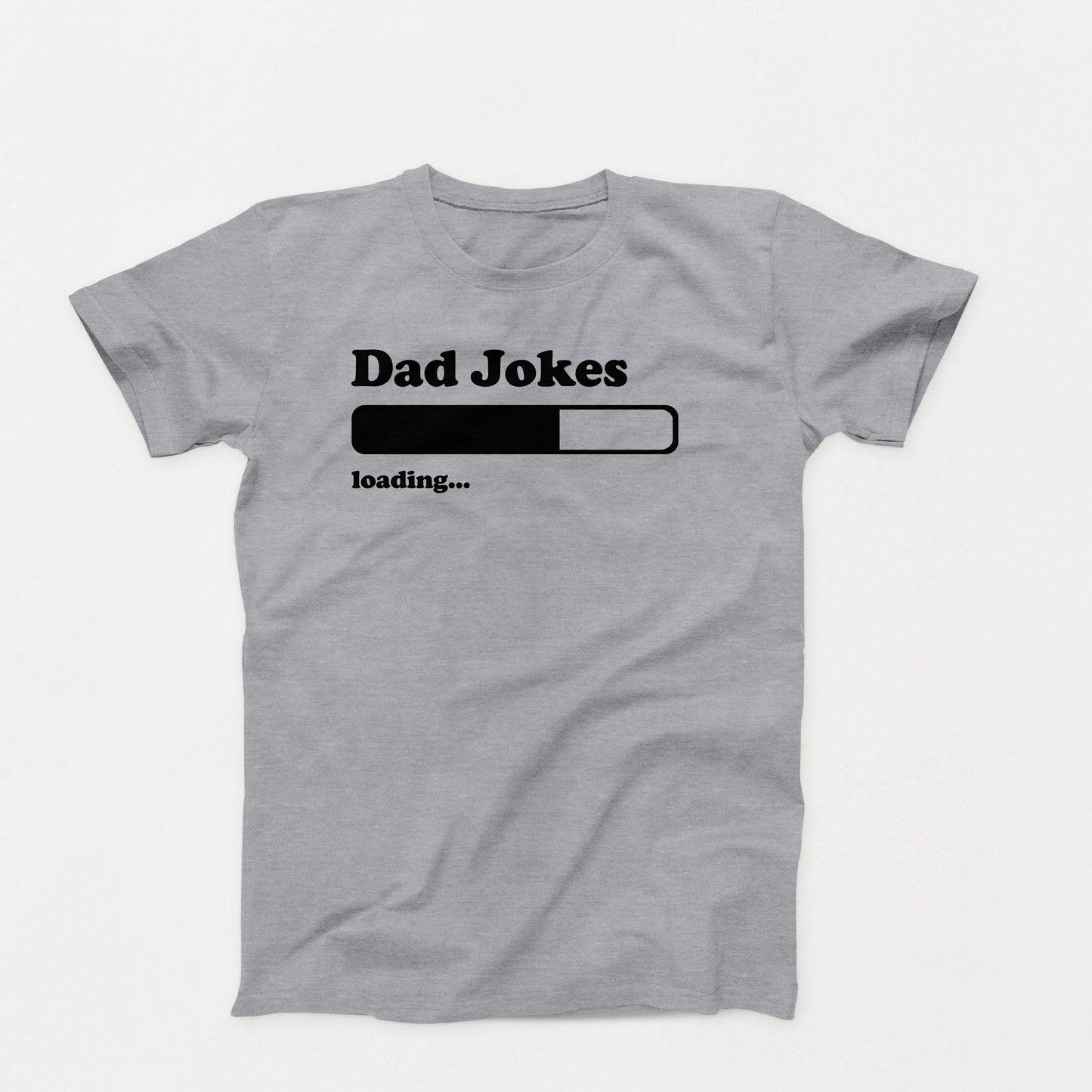 white shirt design with text that reads “Dad Jokes Loading…” and a black progress bar graphic