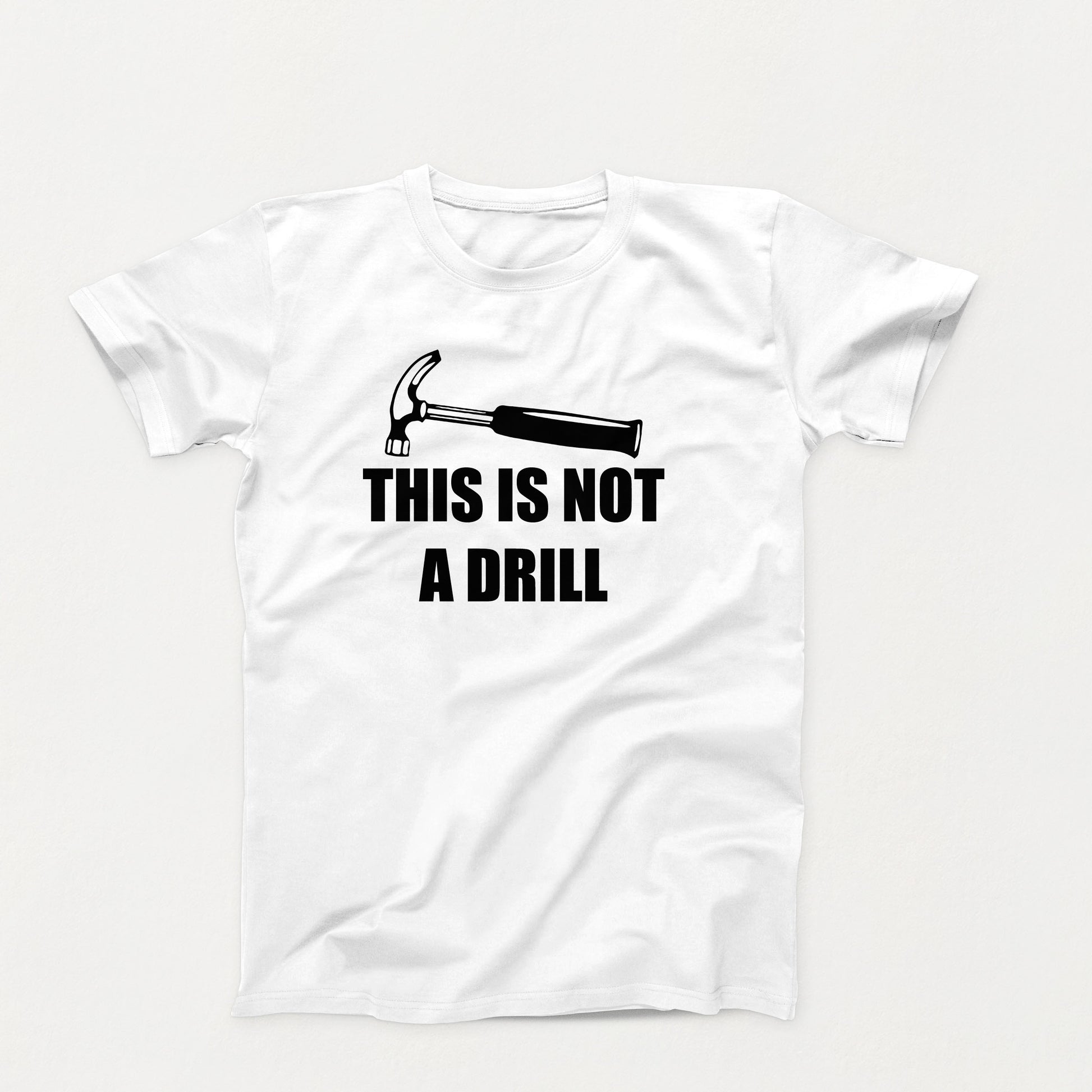 Funny t-shirt design with a hammer and the phrase “This Is Not a Drill” in bold black text on a whie  t-shirt
