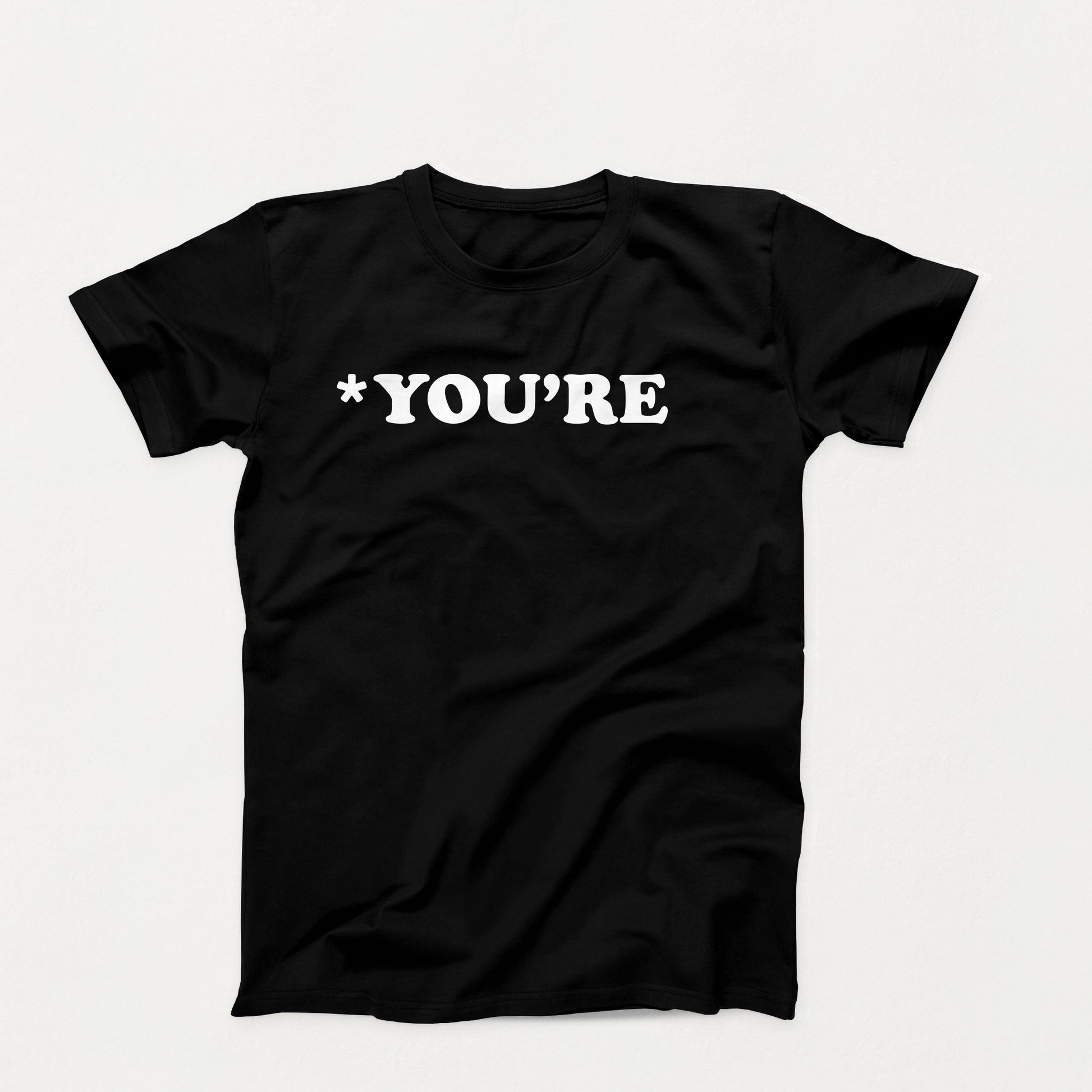 Black t-shirt with white text that reads “*You’re” in bold typewriter-style font, correcting grammar with silent judgment