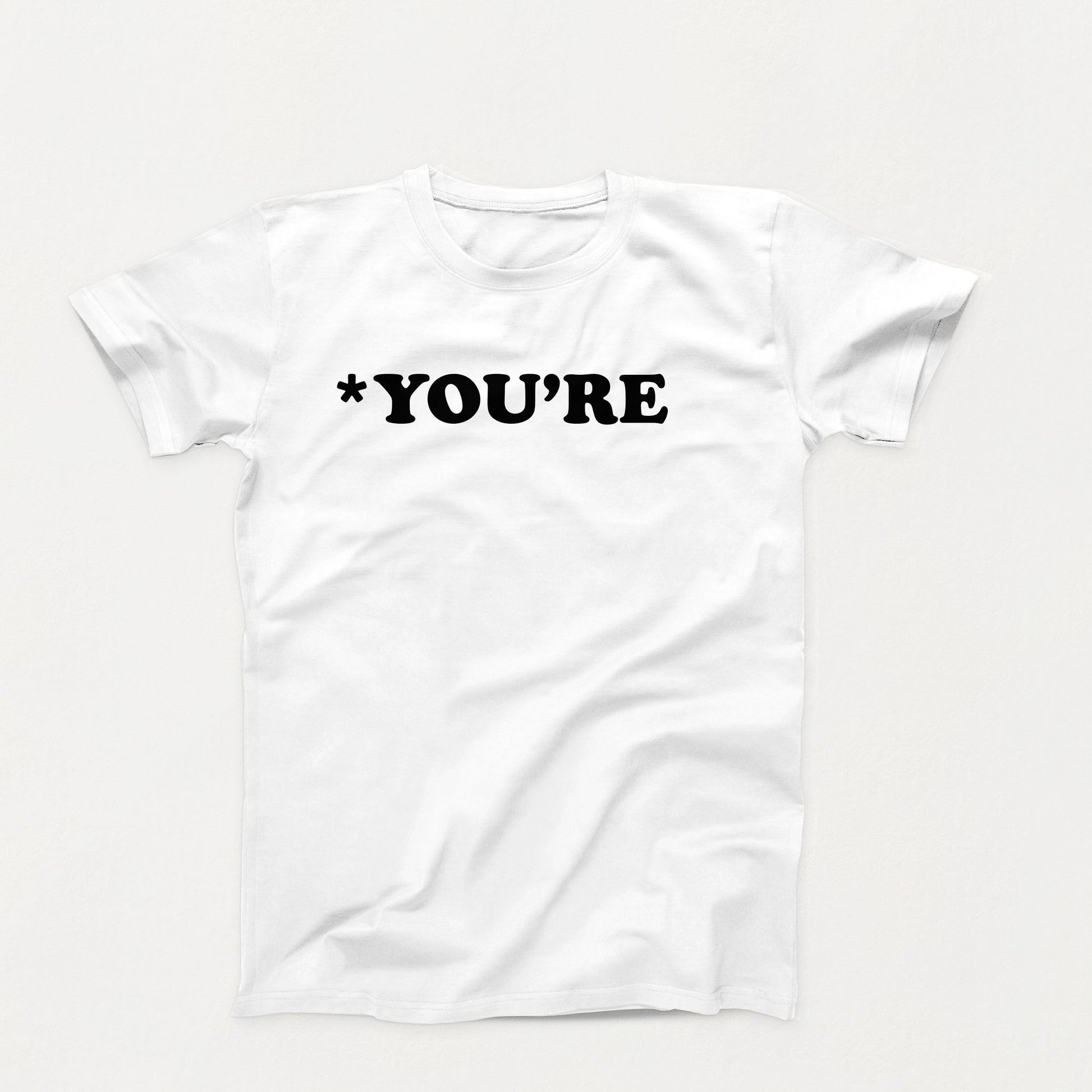 white t-shirt with white text that reads “*You’re” in bold typewriter-style font, correcting grammar with silent judgment