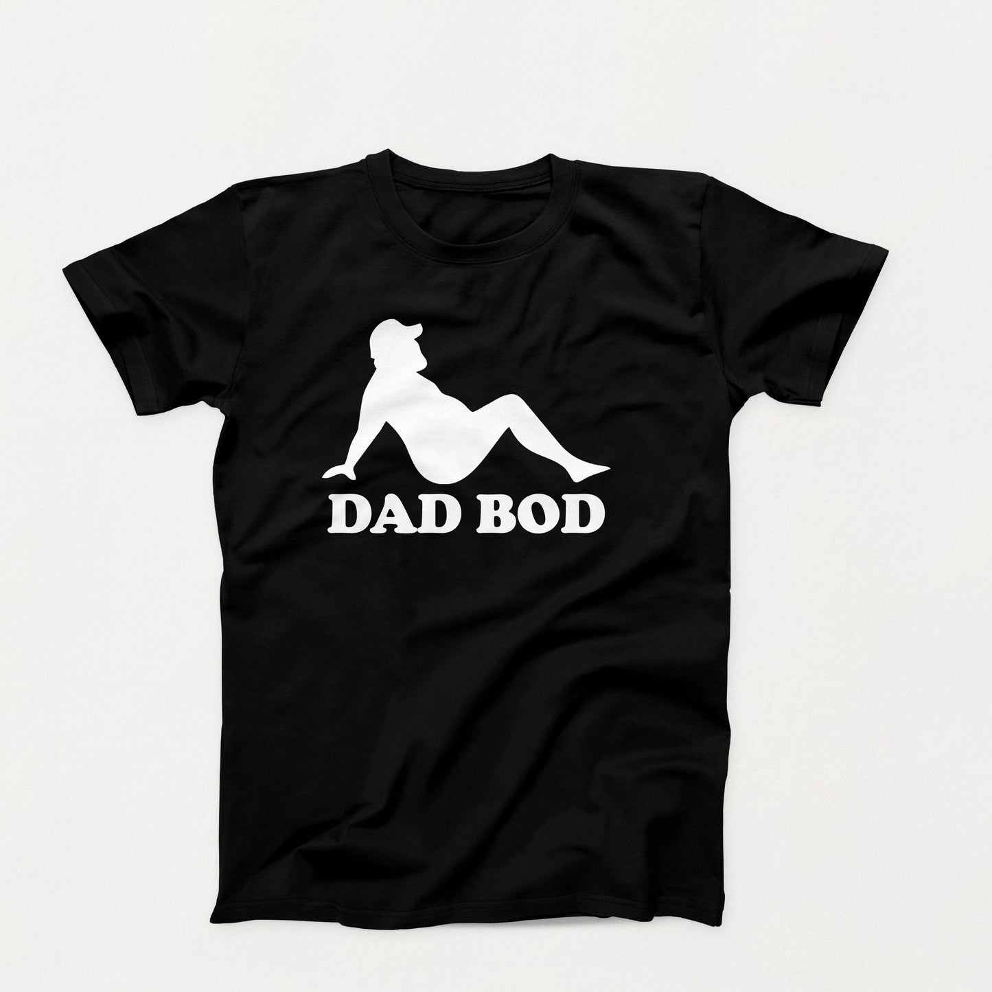 White silhouette of a relaxed bearded man in a cap with the words “Dad Bod” below on a black shirt design