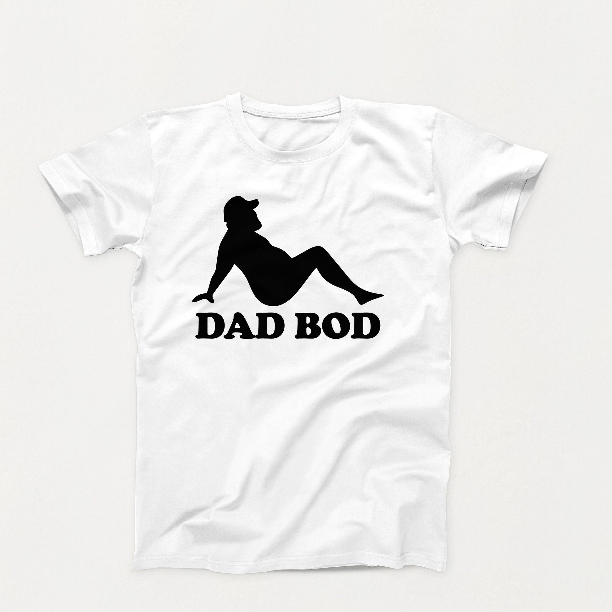 black silhouette of a relaxed bearded man in a cap with the words “Dad Bod” below on a white shirt design