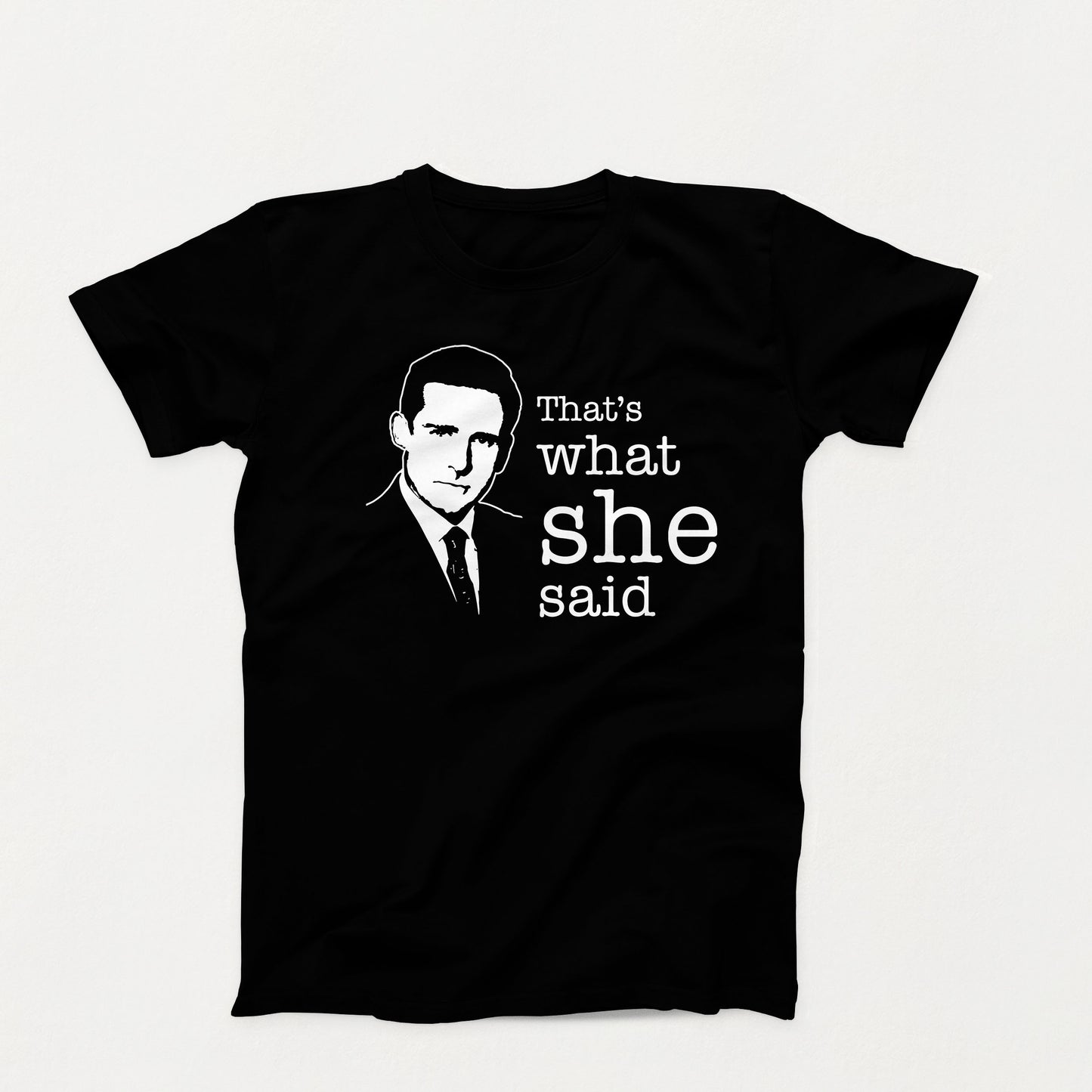 Black and white shirt design with a silhouette of a man in a suit and the phrase “That’s What She Said” in bold typewriter font