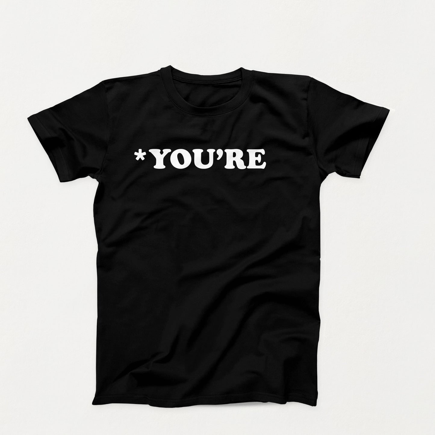 Black t-shirt with white text that reads “*You’re” in bold typewriter-style font, correcting grammar with silent judgment